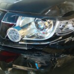 Before and after photographs of a damaged, black, Range Rover that was repaired by Elite Paint & Body Shop in West Palm Beach, FL.